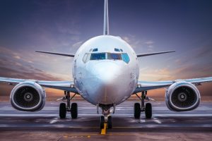 commercial airplane grounded during sunset